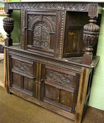 Lot 1346 - A Victorian carved oak court cupboard