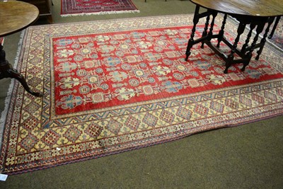 Lot 1363 - Caucasian design carpet, North Afghanistan, the raspberry field with columns of medallions...