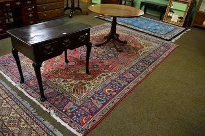 Lot 1364 - A Tabriz carpet, Iranian Azerbaijan, the raspberry field of vines centred by a medallion framed...