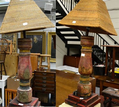 Lot 1370 - A pair of turned wooden lamps, shabby-chic finish, with basketwork frames, 74cm high (2)