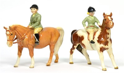 Lot 71 - Beswick Girl on Pony, model No. 1499, Skewbald gloss and Boy on Pony, model No. 1500, Palomino...