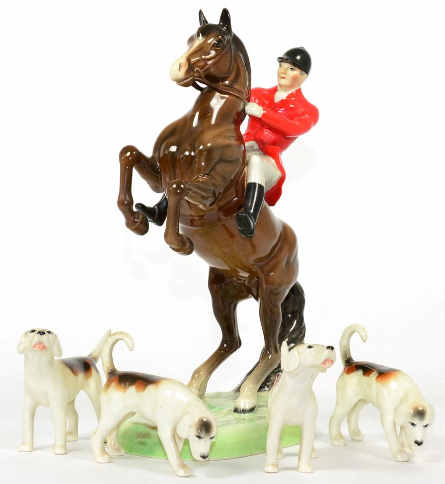 Lot 79 - Beswick Huntsman (On Rearing Horse), model No. 868, Second Version; together with four Fox...