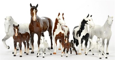 Lot 111 - Beswick Horses and Foals including: Pinto Pony, model No. 1373, piebald gloss and another...