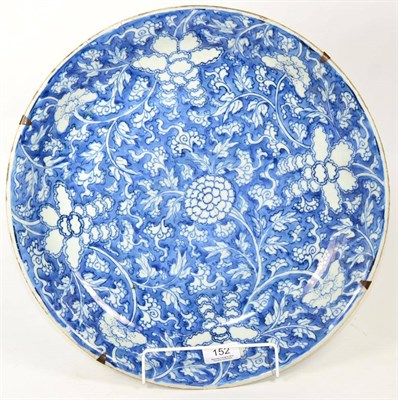 Lot 152 - A Chinese blue and white charger, 18th century, old riveted damage