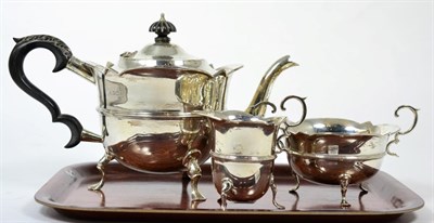 Lot 155 - A silver three piece tea service, Watson & Gillott, Sheffield 1901, circular with reeded...