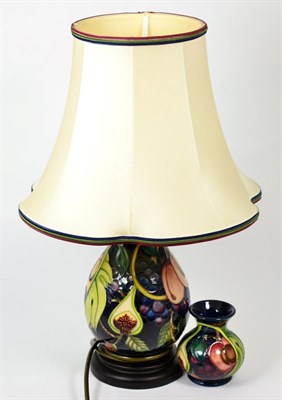Lot 159 - A modern Moorcroft Queens choice pattern table lamp, 29.5cm; and a matching vase (2)