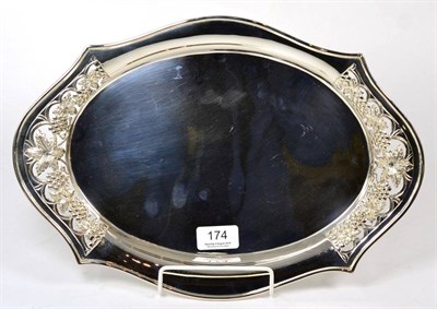 Lot 174 - A silver tray, Roberts & Belk, Sheffield 2000, shaped oval with fruiting vine pierced ends,...