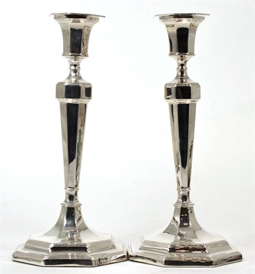 Lot 179 - A pair of silver candlesticks, Hawksworth, Eyre & Co, Sheffield 1912, octagonal with tapering stem