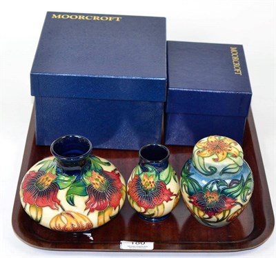 Lot 180 - A modern Moorcroft Anna Lily pattern ginger jar and cover, 11.5cm; and two matching vases (3)