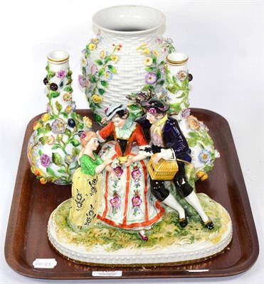 Lot 183 - Continental porcelain including a figural group of a couple and child seated, floral encrusted...