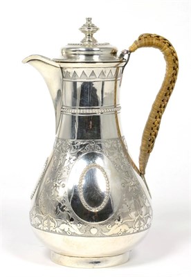 Lot 195 - A Victorian silver hot water or milk jug, Henry Holland, London 1874, baluster with raffia...