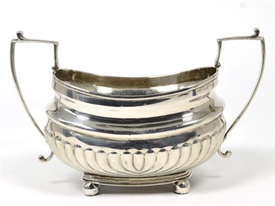 Lot 197 - A George III silver twin handled sugar bowl, makers mark rubbed, London 1814, part fluted on...