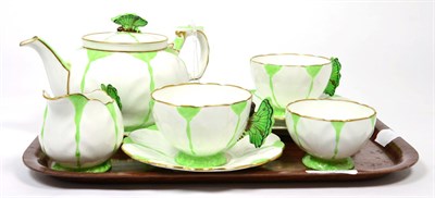 Lot 211 - An Aynsley teaset with butterfly handles, pattern number 1322 on a green and cream ground...