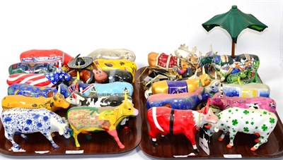 Lot 240 - A large group of cow parade porcelain and resin figures (two trays)