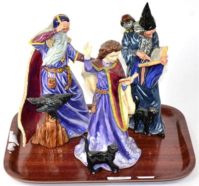 Lot 243 - Three Royal Doulton figures; Wizard; The Sorceress and The Sorceress