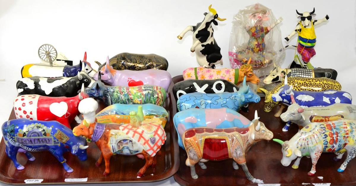 Lot 245 - A large group of cow parade porcelain and resin figures (two trays)