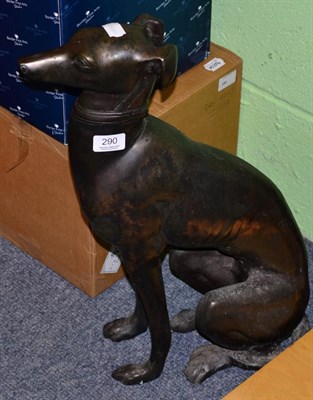 Lot 290 - A patinated metal model of a seated greyhound