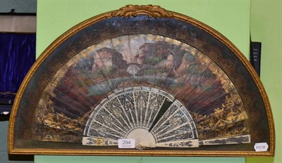 Lot 294 - A 19th century Continental pierced bone and painted fan, in a glazed display case