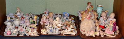 Lot 305 - A large quantity of china half dolls, bisque figures, miniature tea wares etc (one shelf)