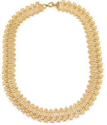 Lot 324 - A 1970s 9 carat gold collar necklace, of textured and pierced links, length 41cm