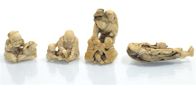 Lot 335 - Four Japanese ivory netsuke, Meiji period, late 19th/20th century, comprising an elderly lady...