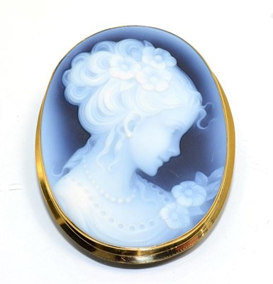 Lot 341 - A carved sardonyx came brooch, depicting a female bust, in an 18 carat gold frame, measures 5cm...