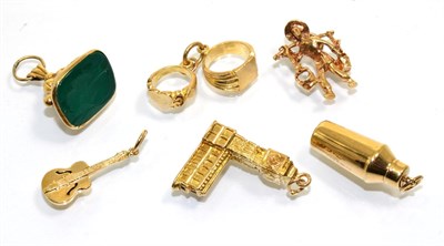 Lot 349 - Six various 9 carat gold charms, including; a figure, Big Ben, a guitar, a cocktail shaker, a...