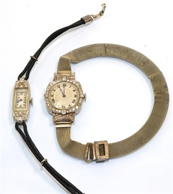 Lot 350 - A lady's 1930s diamond set wristwatch and a lady's diamond set rectangular wristwatch, case...