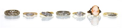 Lot 355 - A diamond five stone ring, in illusion settings to bypass scroll shoulders, finger size K1/2,...