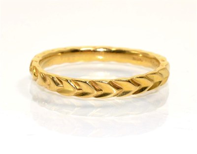 Lot 377 - A 22 carat gold chevron motif band ring, finger size R