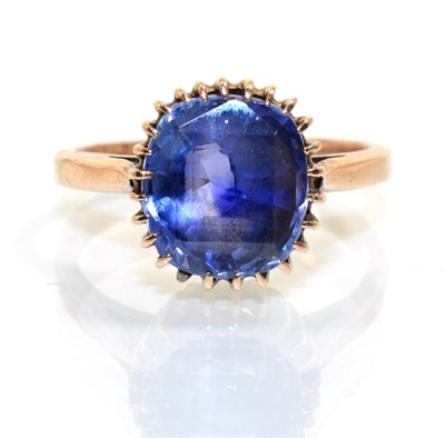 Lot 378 - A sapphire ring, an oval cut sapphire in a claw setting, to tapered shoulders, finger size N1/2