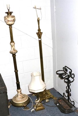 Lot 1041 - A brass Corinthian columnar standard lamp; a similar table lamp; a brass and pottery standard lamp