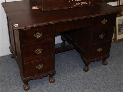 Lot 1043 - A South African hardwood twin pedestal desk