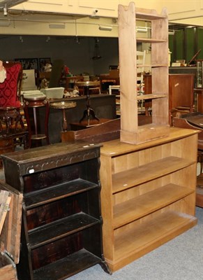 Lot 1048 - An oak three-tier open bookcase; a narrow pine five-tier open bookcase; and an stripped oak...