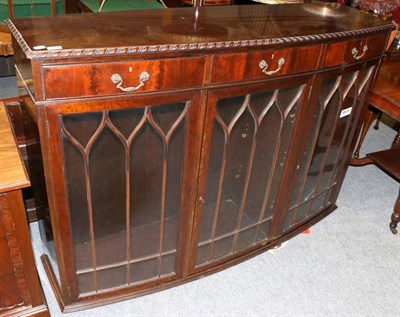 Lot 1063 - A mahogany glazed three door low bookcase