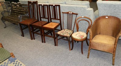 Lot 1069 - A wooden slatted garden bench with cast iron ends; together with six various chairs (7)