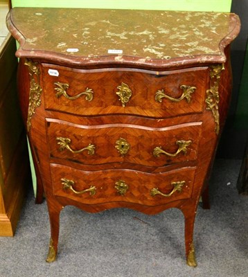 Lot 1183 - A French gilt metal mounted parquetry three drawer commode, of bombe shape, with marble top