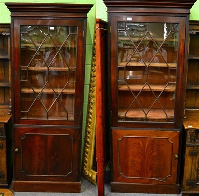 Lot 1188 - A pair of Georgian style glazed bookcases