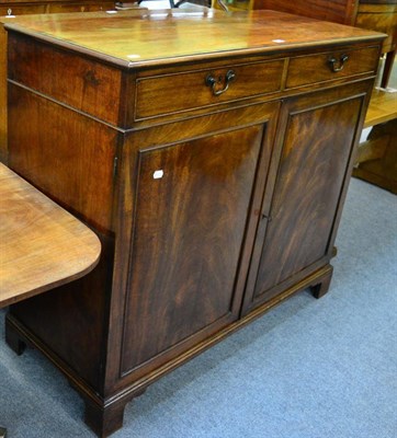 Lot 1204 - A 19th century mahogany dwarf press the two frieze drawers above two cupboard doors opening to...