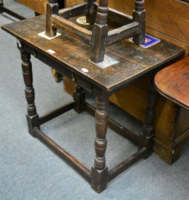 Lot 1208 - An oak side table on turned supports, with single drawer