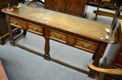 Lot 1214 - A 17th century and later oak low dresser, moulded top over two drawers, shaped supports, 182cm wide