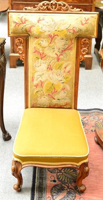 Lot 1220 - A Victorian walnut Prie Dieu chair