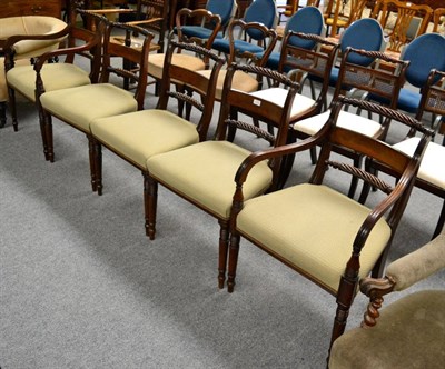 Lot 1232 - A set of five Regency mahogany dining chairs including two carvers and each with rope twist...