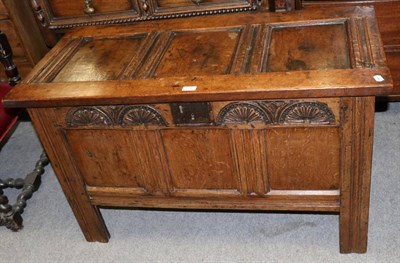 Lot 1242 - A 17th century style three-panelled oak coffer with lunette carved details, 110cm wide