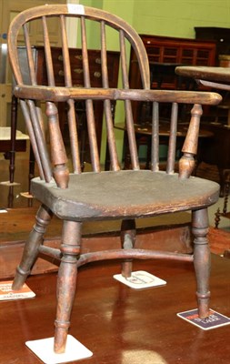 Lot 1249 - An elm child's Windsor chair