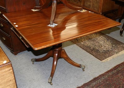 Lot 1251 - George III mahogany drop-leaf table with central drawer