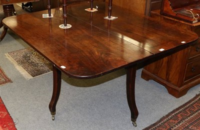 Lot 1258 - A 19th century drop leaf mahogany table, probably formerly one end of a dining table