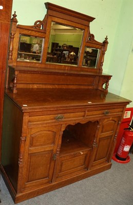 Lot 1270 - An oak mirror backed sideboard