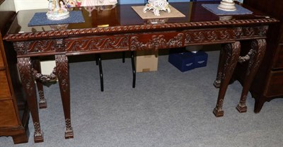 Lot 1280 - A Reproduction carved mahogany serving table