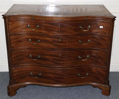 Lot 1289 - A George III mahogany serpentine fronted four height chest of drawers, with brushing slide,...